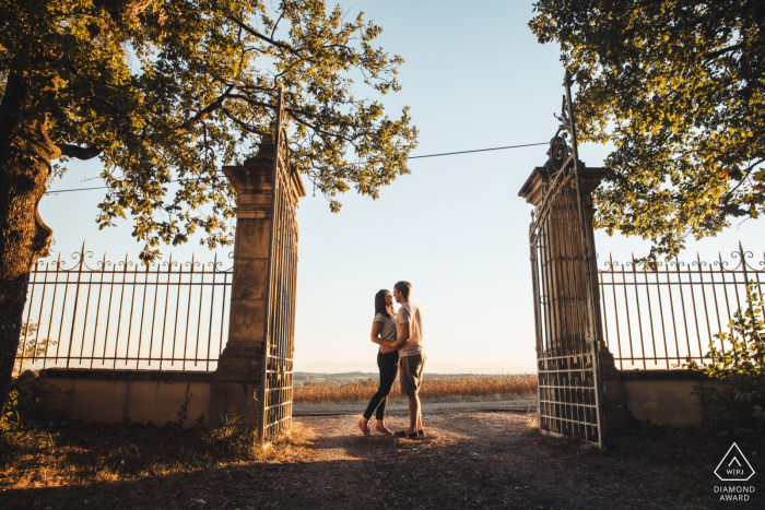 Chateau de Lartigolle couple portrait as they hold one another Chateau de Lartigolle couple portrait as they hold one another
