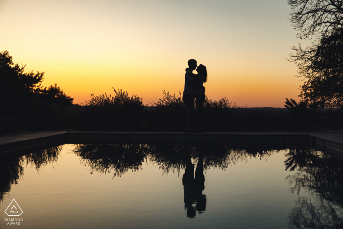 Chateau de Lartigolle, Gers sunset couple portrait as they hold each other in this silhouette