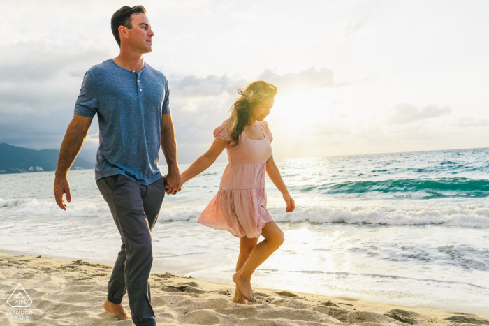 Conchas Chinas, Puerto Vallarta beach couple portrait walking along the water's edge