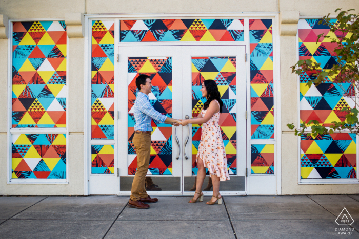 Los Gatos couple shoot in front of a colorful window and door display