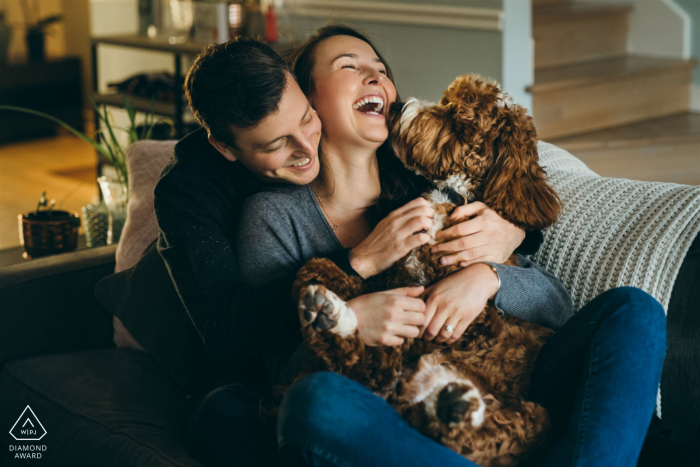 Pre wedding Chicago couple portrait of cuddling on a couch