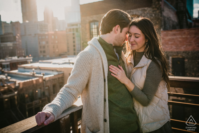 Chicago, IL pre wedding shoot of couple taking in the warm sun together on a Chicago rooftop