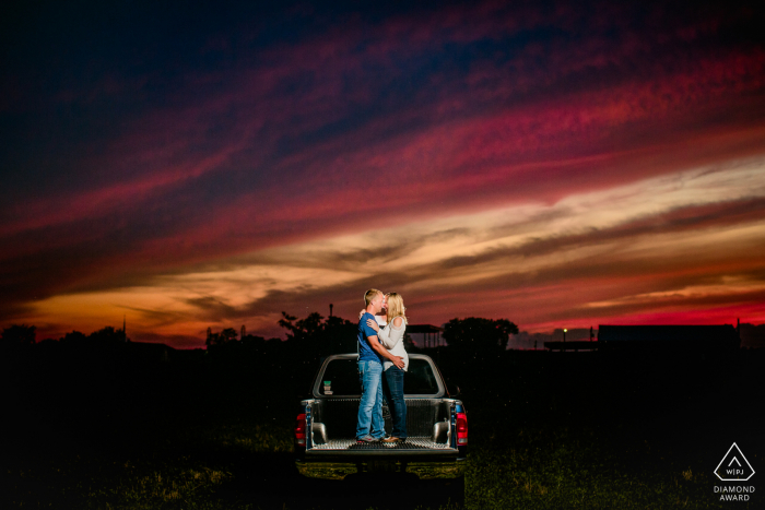 Peoria couple portrait tailgating at sunset Peoria couple portrait tailgating at sunset