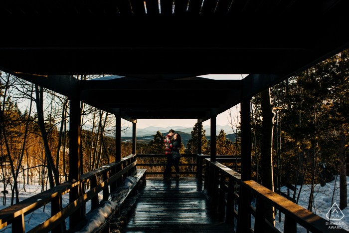 Colorado pre-wed portrait at Golden Gate Canyon State Park with the Couple standing in the deck/lookout area Colorado pre-wed portrait at Golden Gate Canyon State Park with the Couple standing in the deck/lookout area