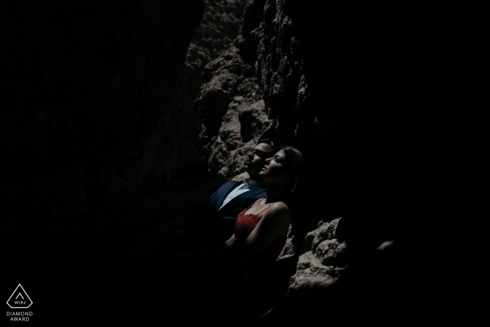 Atacama Desert engaged couple picture session with dark tones and rocks