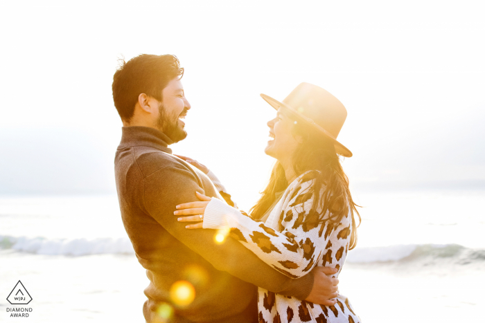 Sunset Cliffs Artful Engagement Picture in San Diego, CA with the beach and waves in the background