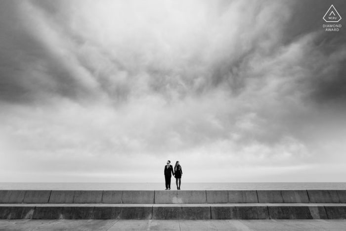 Adler Planetarium, Chicago Fine Art Engagement Session for a Couple on embankment overlooking Lake Michigan