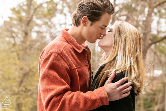 Orpheus Brewing, Atlanta Fine Art Engagement Image showing A gentle kiss after he proposed 