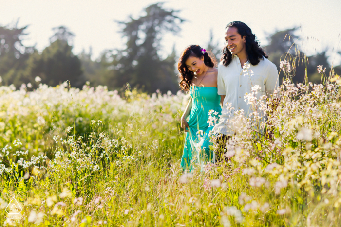 Santa Cruz Artful Engagement Photography showing Lovers walking through a flower field on a warm, lovely day in Spring