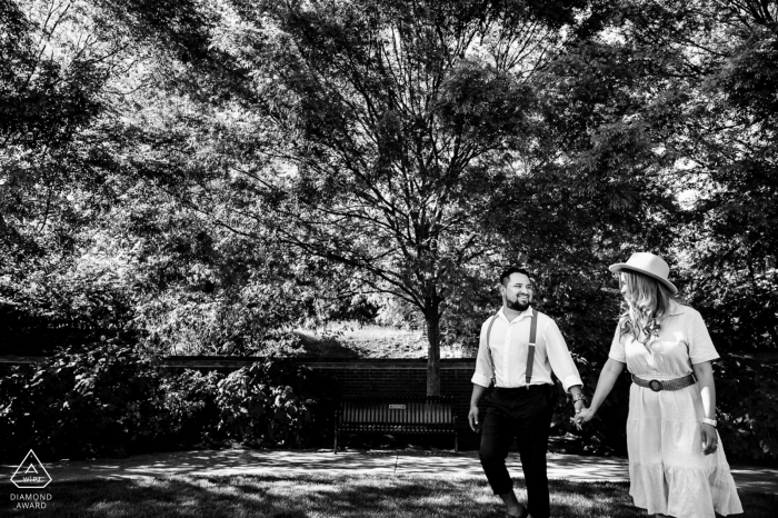 Volunteer Landing Park, TN environmental engagement e-session of a couple walking through the park as they hold hands