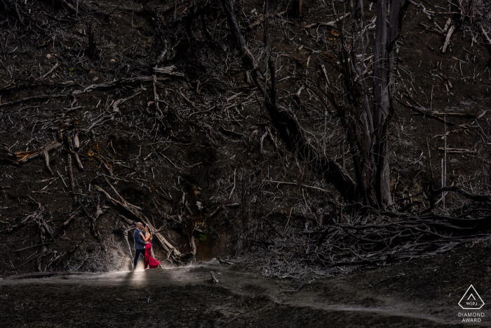 Hacienda La Central, Cartago, CR environmental engagement e-session of a couple standing in front of a burned forest in the skirt of the Turrialba Volcano 