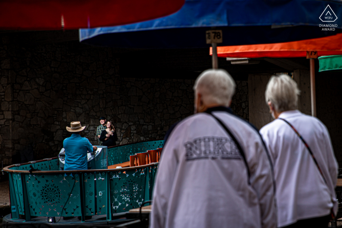 Riverwalk/San Antonio, TX on-location portrait e-shoot created as the Couple plays by the riverwalk as tourist walk by