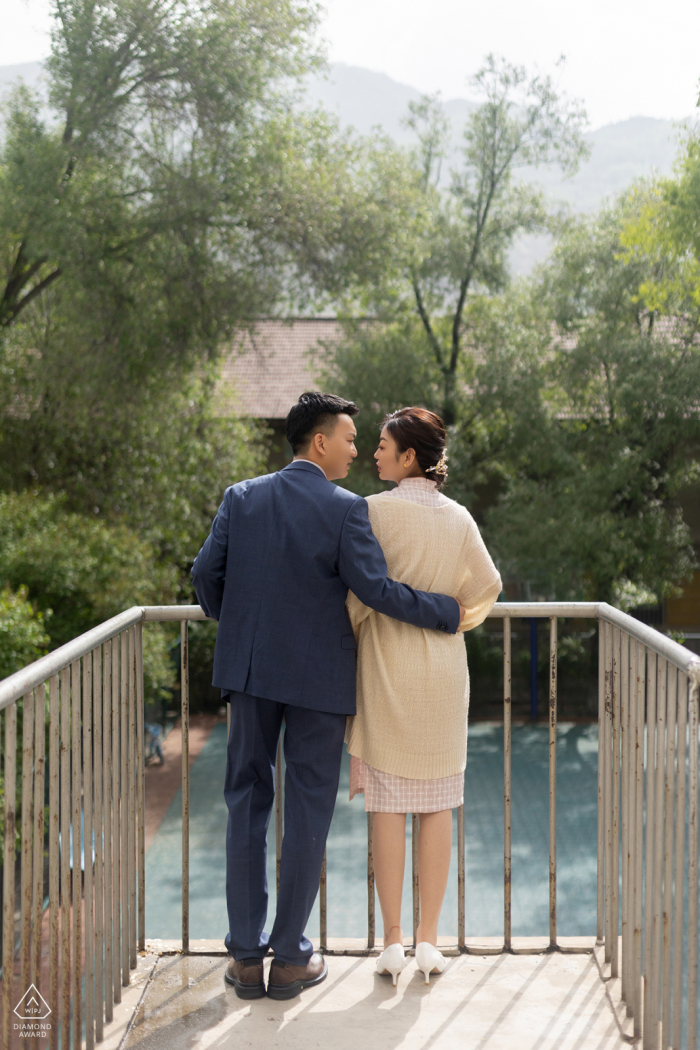 Xining City portrait e-session of a couple against a handrail