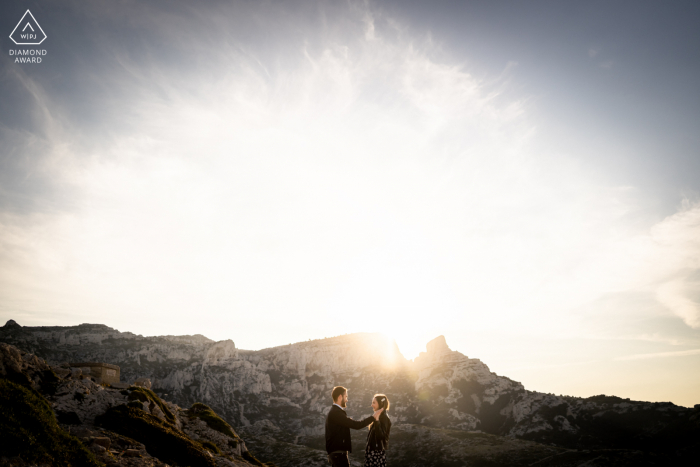 True Love Pre-Wedding Portrait Session in Marseille capturing a couple watching the sun rising behind them True Love Pre-Wedding Portrait Session in Marseille capturing a couple watching the sun rising behind them