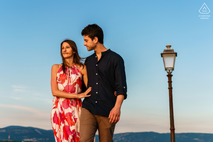 True Love Engagement Portrait Session in Muggia displaying a couple Walking by the sea in Italy