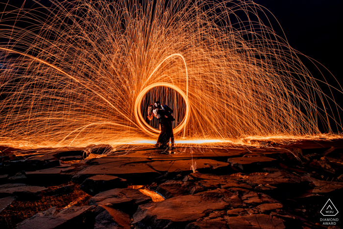 Minnesota couple e-session at Two Harbors with a firewheel nearby