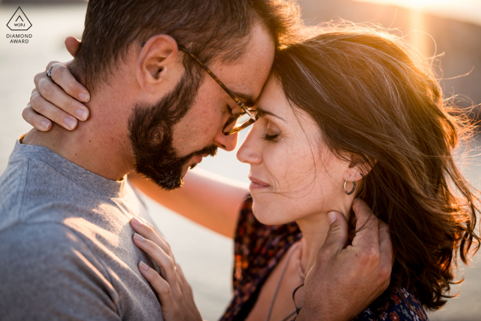 Marseille, France couple e-session with intimate embrace in the sunset sunlight