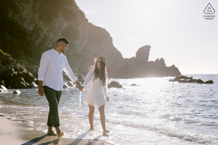 Tropea, italy environmental couple pre wedding image session while walking along the sea shore