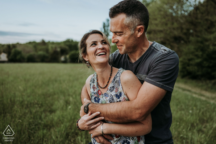 Saint Maigrin, France environmental pre wedding image session with a couple embracing