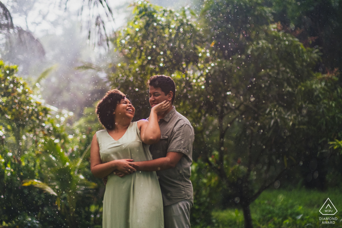 Maceió pre-wedding engagement photoshoot for a couple who is showing their Love in the Brazil rain