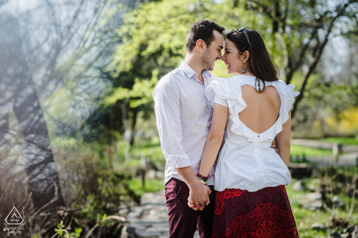 Sofia post proposal portrait photos of a happy Bulgaria couple showing off their love hearts under the trees