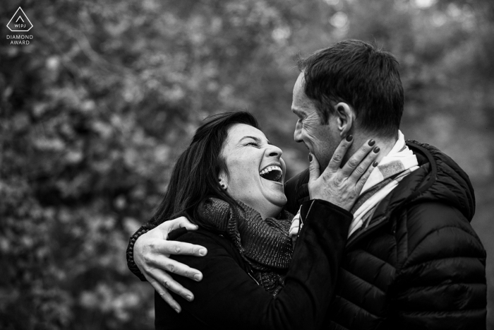 Meurthe-et-Moselle Engagement. A young Nancy couple posing during a BW portrait session outdoors with laughter a pre wedding portrait session