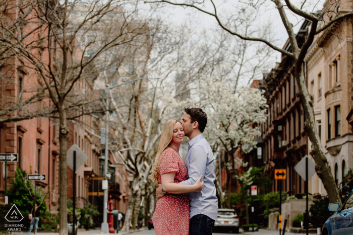A pre wedding photoshoot from Brooklyn Heights Promenade as the couple stop for a kiss in the middle of the road A pre wedding photoshoot from Brooklyn Heights Promenade as the couple stop for a kiss in the middle of the road