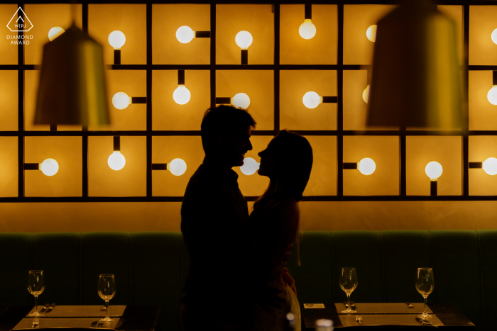 Engagement Photos Brazil. A Rio de Janeiro couple pose as they entered a hotel with these lights on the walls