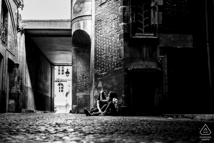 An after the marriage proposal Toulouse engagement photograph created in BW In the dark of a private place