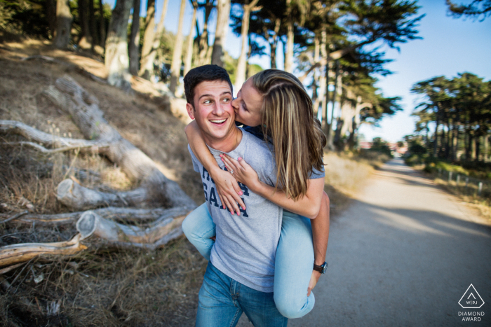 Save the Date in San Francisco. Northern California portrait showing that Love is having a piggy ride Save the Date in San Francisco. Northern California portrait showing that Love is having a piggy ride