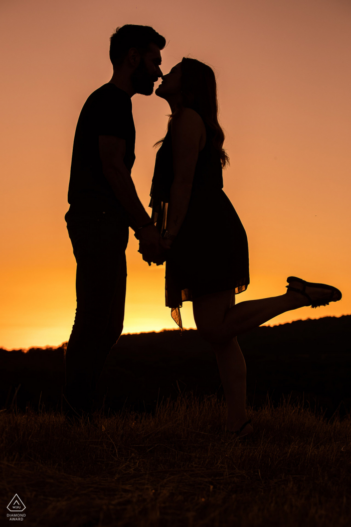 Nancy couple poses for fun portraits with Just a kiss at sunset to announce their France engagement