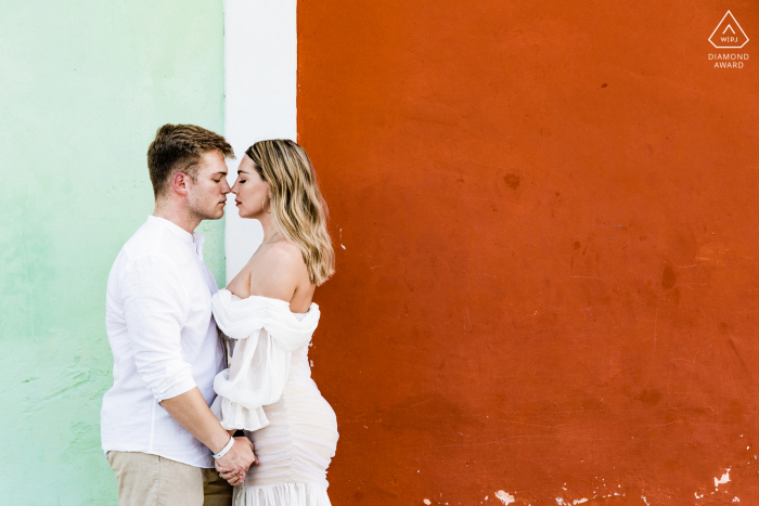 Valladolid engagement photography portfolio image with a Yucatan couple for a pastel Blue and Red wall portrait 