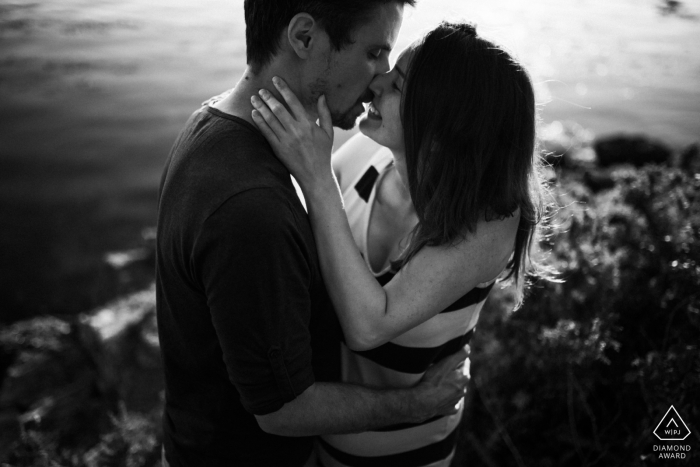 A Brittany, on location couple lifestyle portrait in BW of the kiss by the water