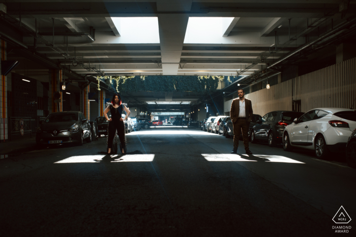 Paris lifestyle photography session showing the light couple in an underground parking structure Paris lifestyle photography session showing the light couple in an underground parking structure