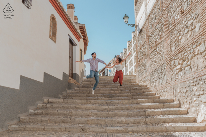 A Granada Couple is Jumping Down Stairs During their Spain Pre-Wedding Photoshoot A Granada Couple is Jumping Down Stairs During their Spain Pre-Wedding Photoshoot