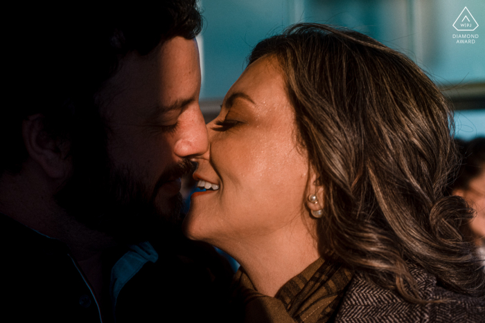 At IMS, São Paulo, Brazil, a shadow of a kiss during a couple portrait session