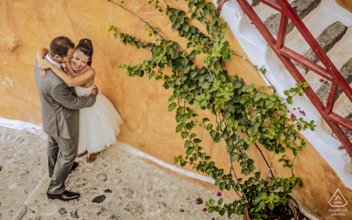 The couple posed for their save-the-date engagement announcement in the romantic and colorful Oia, Santorini