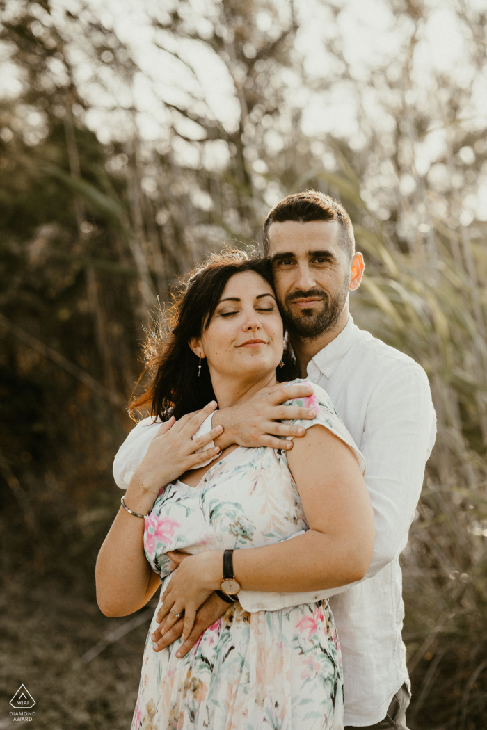 The couple embraced in a romantic Mauguio garden bathed in the soft light of a setting sun