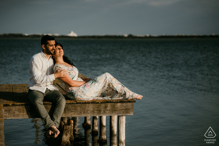 This engaged couple took a brief pause on a wooden dock overlooking the Etang de L'Or in Mauguio