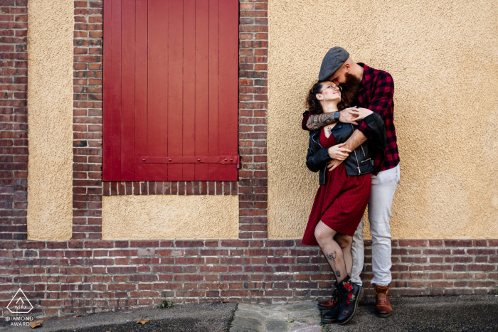 Amidst the Charms of Dreux: A Heartfelt Embrace, Moments Before 'I Do At Dreux, a couple embraces in the city, showcasing their love and excitement before their wedding day, captured beautifully by a top Dreux engagement photographer.