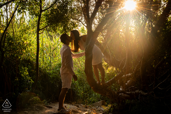 Enchanted Sunset: A Romantic Engagement at Presqu'île de Giens Presqu'île de Giens provides the perfect sunset setting for this couple's romantic engagement session, captured by a skilled WPJA wedding photographer amidst the fairytale-like backdrop of the forest.