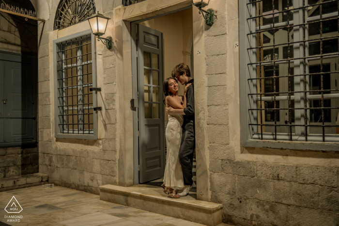 Love on Hydra Island's Old World Porch Capturing timeless love on picturesque Hydra Island in Greece, a WPJA photographer frames a romantic couple on the porch of an Old World stone building in Argolida.