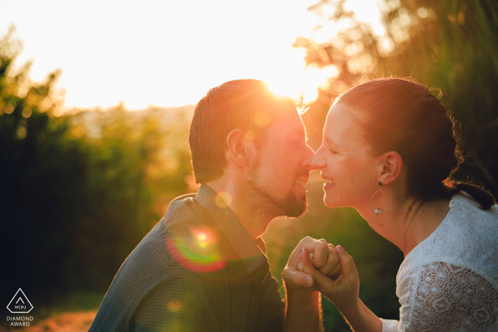 Lovely Couple Enjoys Sunset in Mont Brouilly, Beaujolais In the charming town of Mont brouilly, Beaujolais, the lovely couple enjoys sunset time together.