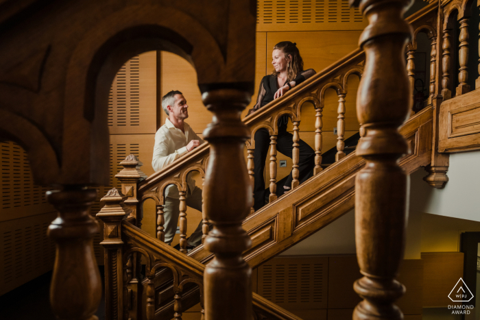 Couple's Engagement Portrait on Town Hall Stairs in Vannes, Morbihan, France In the beautiful town of Vannes, the couple stands on the indoor stairs of the town hall for their engagement portrait in Morbihan, France.