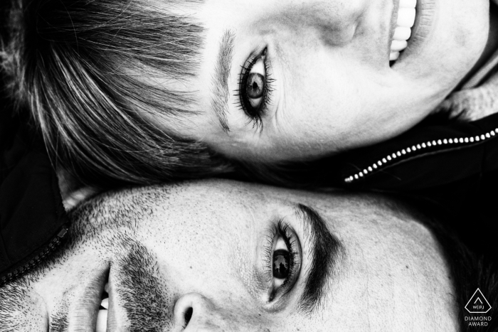 Engaged Couple in Zaragoza, Spain, in Tight Black-and-White Frame | Yin-Yang Composition Highlights Connection and Harmony In Zaragoza, Spain, a tightly framed black-and-white shot captures an engaged couple's faces turned in opposite directions, embodying a yin-yang composition. The artistic contrast highlights their connection and harmony.