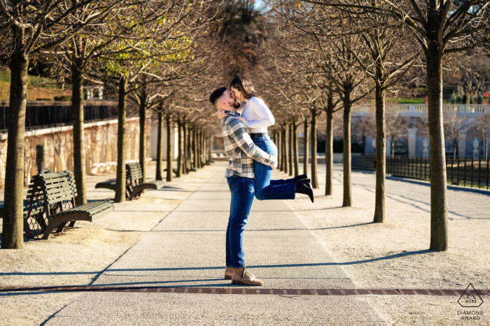 Stephen joyfully lifts Talene at Longwood Gardens, Philadelphia, moments before their first kiss engaged.