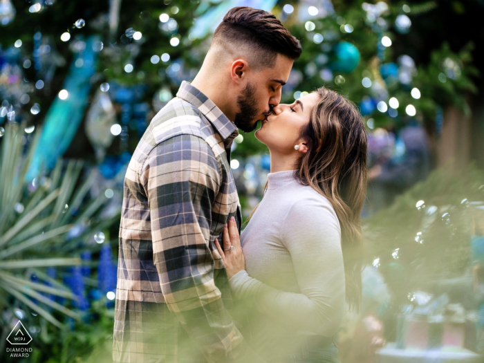 A close pre-wedding embrace that radiates intense passion and profound affection. The Longwood Gardens setting provides a cool backdrop, creating an ethereal image that feels entirely devoted to their connection.
