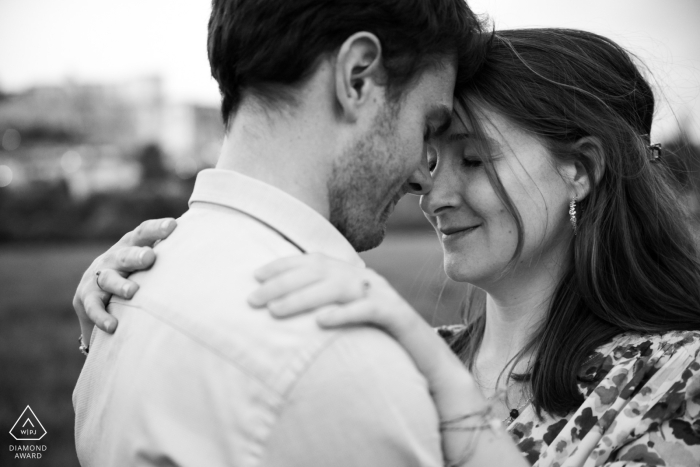 This romantic portrait captured in Grignan, Drôme Provençale, France, showcases the couple sharing an intimate connection just in the beautiful light after the sunset.