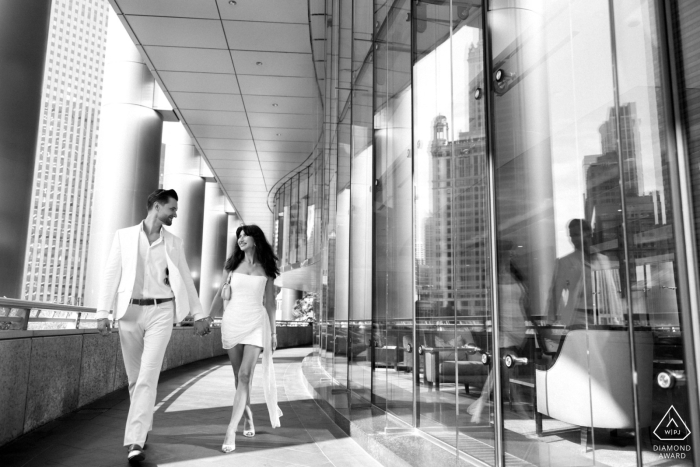 In downtown Chicago, this black-and-white, magazine-style portrait captures modern elegance as the couple's love is reflected amidst the glowing city.