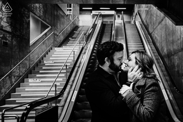 In São Paulo, Brasil, this bold black-and-white portrait captures a couple sharing a kiss on a stairway landing, surrounded by striking graphic geometric shapes.